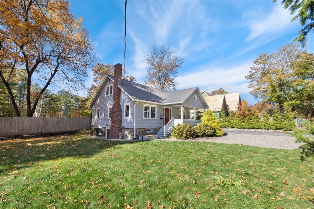 928 Main Street Lynnfield, MA 01940 - Photo 40 of 41 a view of a house with a big yard and large trees