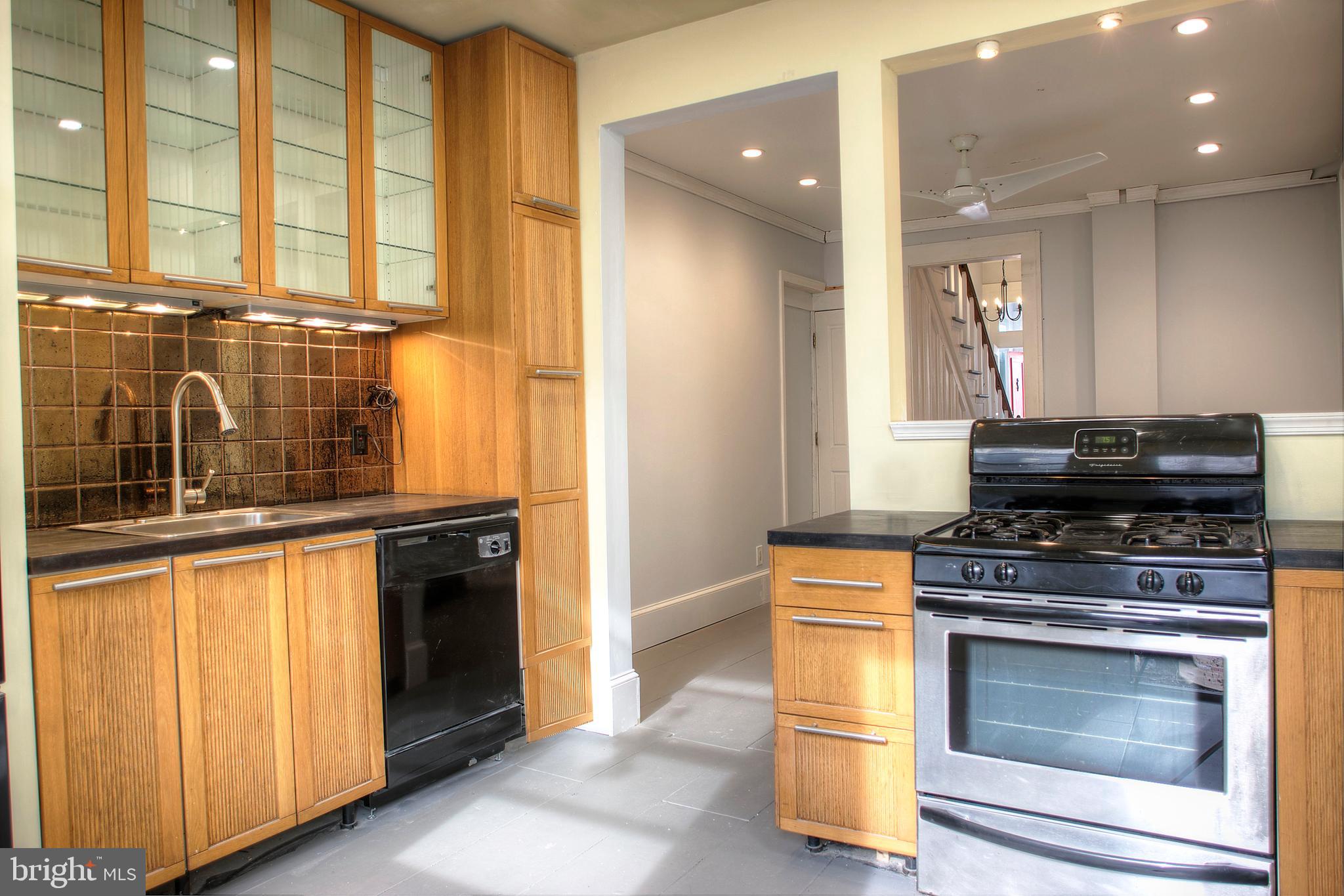 1228 Catharine Street Philadelphia, PA 19147 - Photo 11 of 32 a kitchen with a stove and a sink