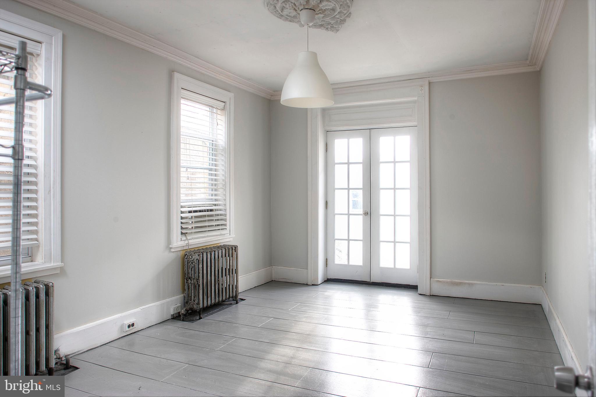 1228 Catharine Street Philadelphia, PA 19147 - Photo 14 of 32 a view of an empty room with a window