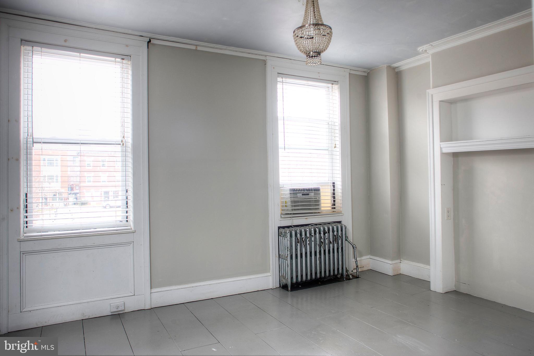 1228 Catharine Street Philadelphia, PA 19147 - Photo 18 of 32 an empty room with windows