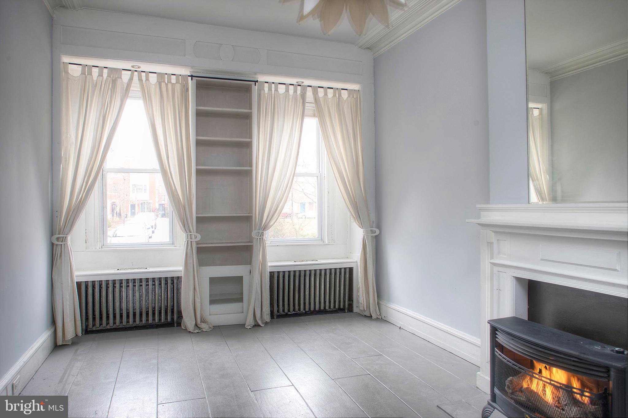 1228 Catharine Street Philadelphia, PA 19147 - Photo 2 of 32 an empty room with windows