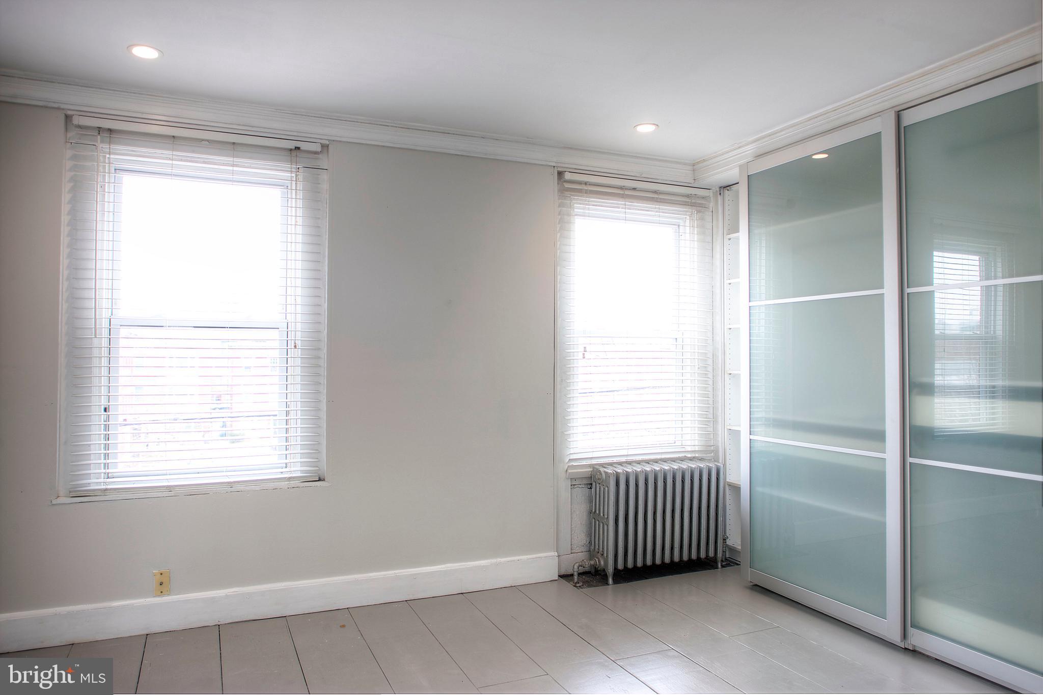 1228 Catharine Street Philadelphia, PA 19147 - Photo 21 of 32 a room with windows and closet
