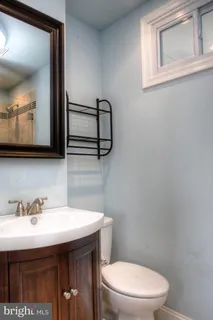 a room with a baby crib and a window