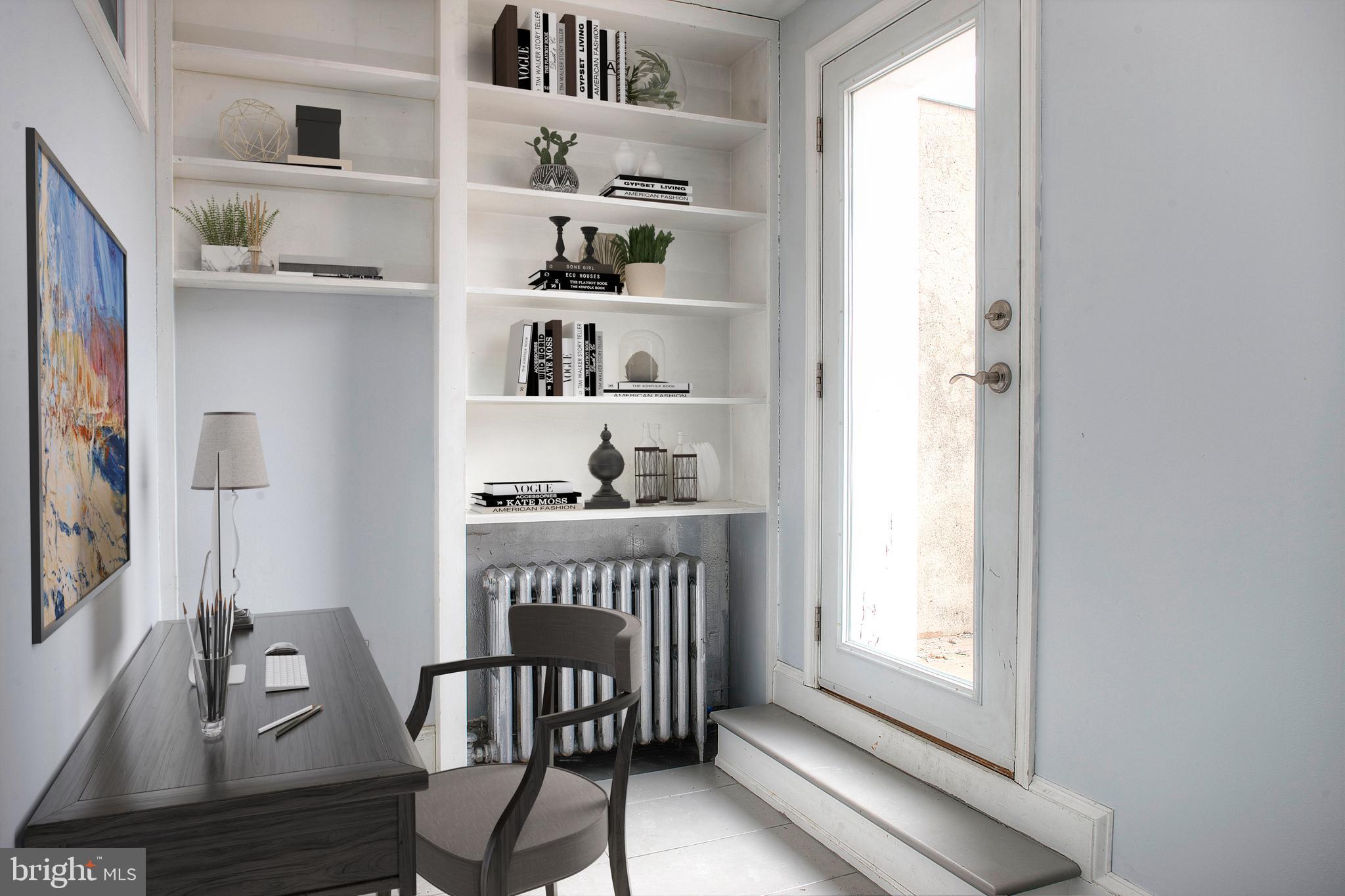 1228 Catharine Street Philadelphia, PA 19147 - Photo 23 of 32 a room with a baby crib and a window