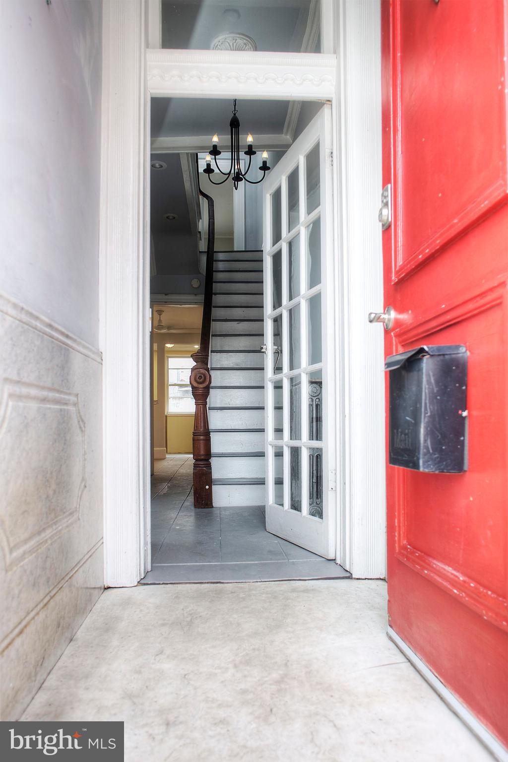 1228 Catharine Street Philadelphia, PA 19147 - Photo 29 of 32 a view of a house with a door and wooden bench