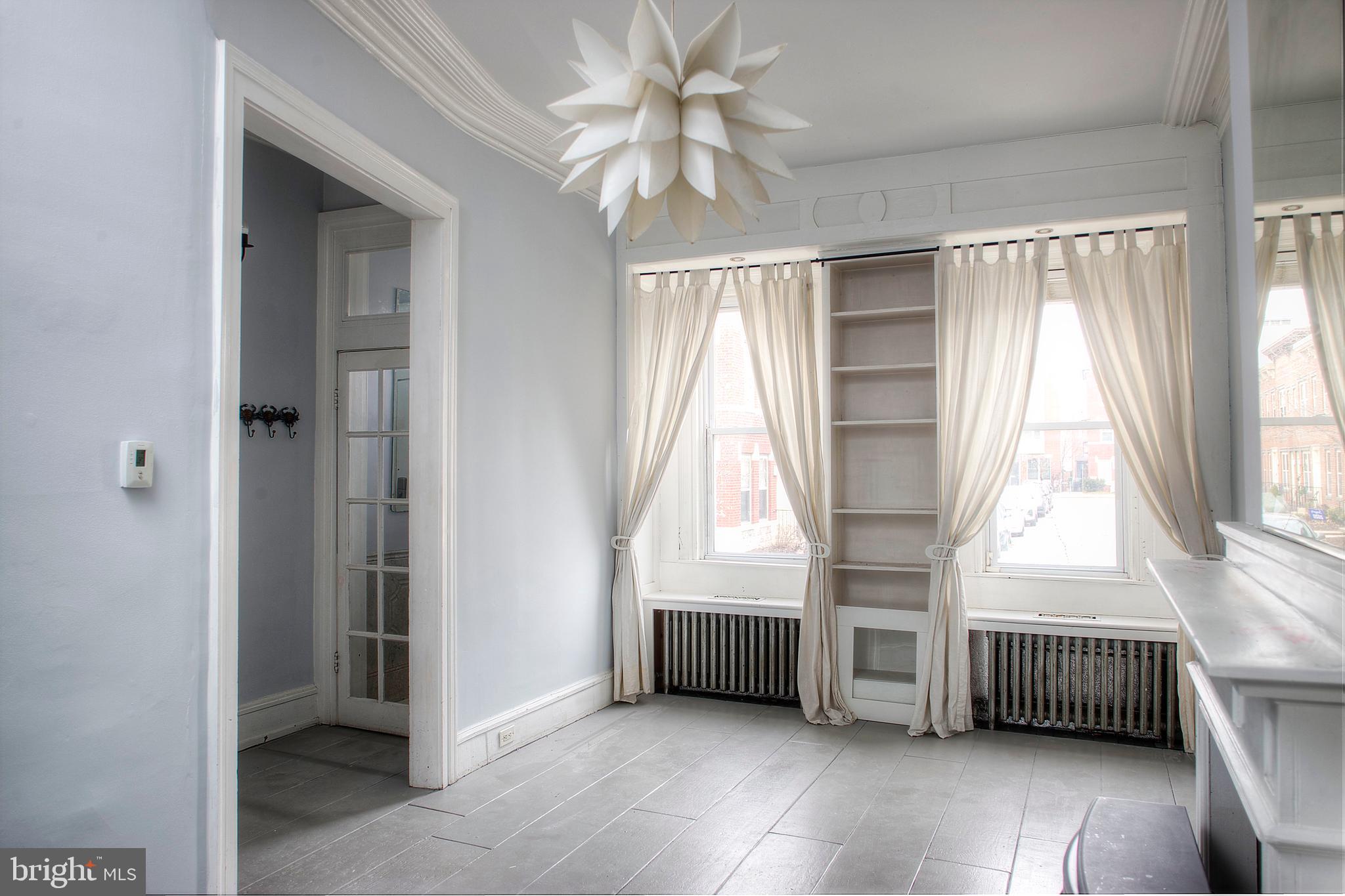 1228 Catharine Street Philadelphia, PA 19147 - Photo 5 of 32 a view of an empty room with a window