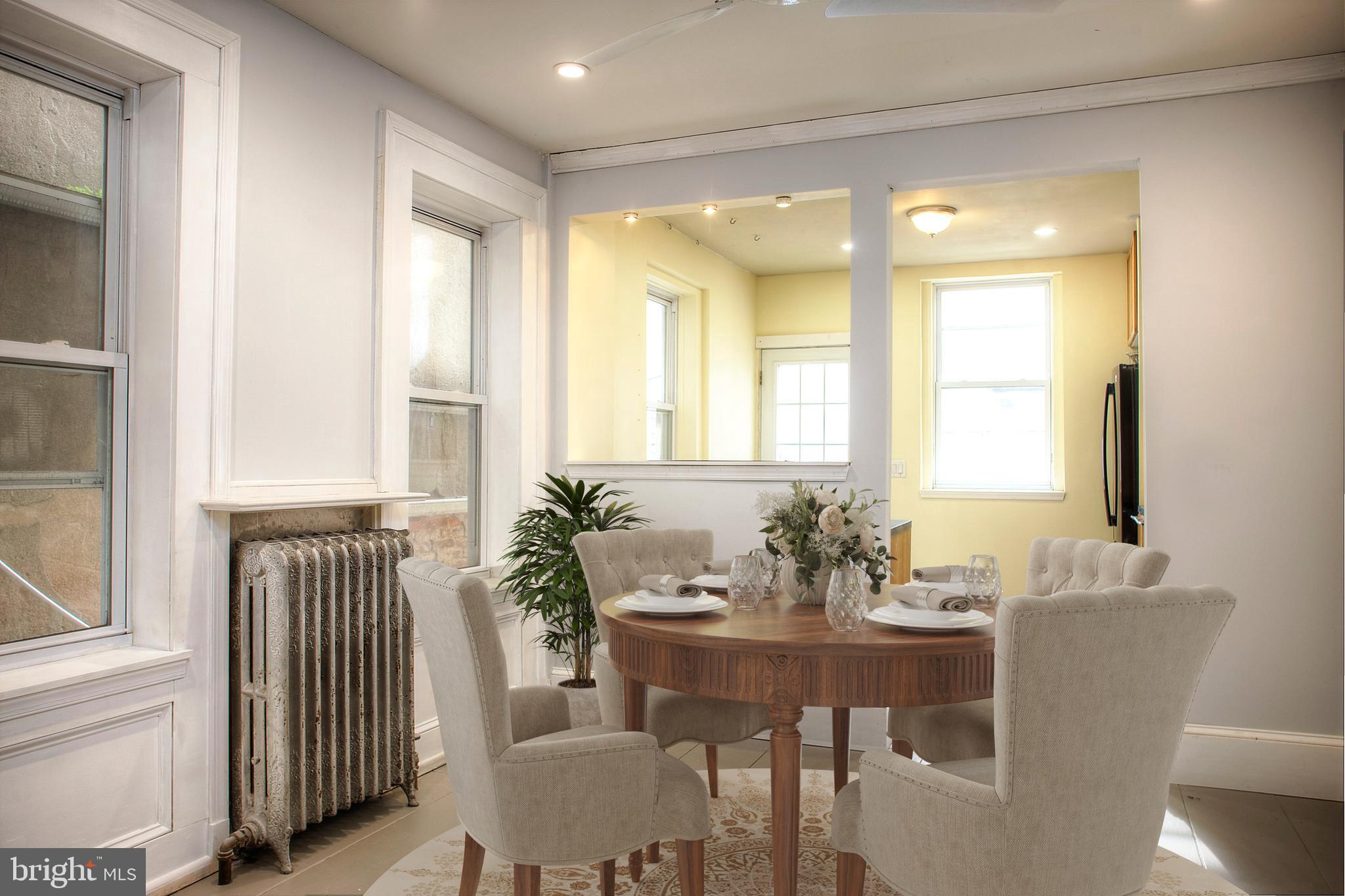 1228 Catharine Street Philadelphia, PA 19147 - Photo 9 of 32 a view of a dining room with furniture and window