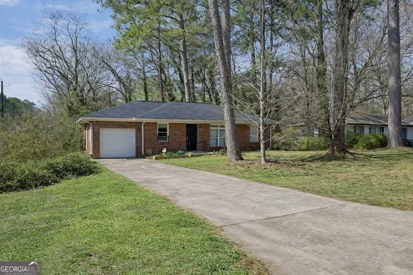 front view of a house with a yard
