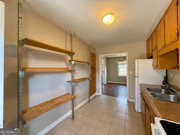 a view of a hallway with a living room