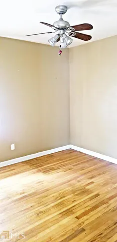 a view of a livingroom with wooden floor
