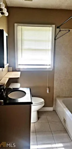 a bath tub sitting in a bathroom