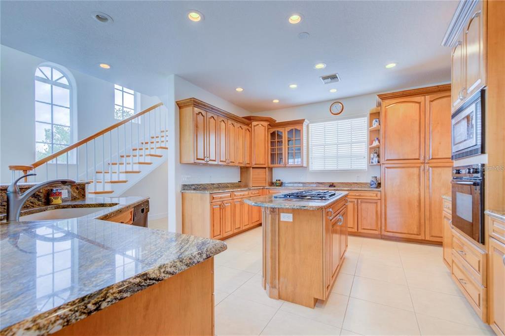 7352 Gulf Way Hudson, FL 34667 - Photo 14 of 69 a kitchen with stainless steel appliances granite countertop a sink a stove and a refrigerator