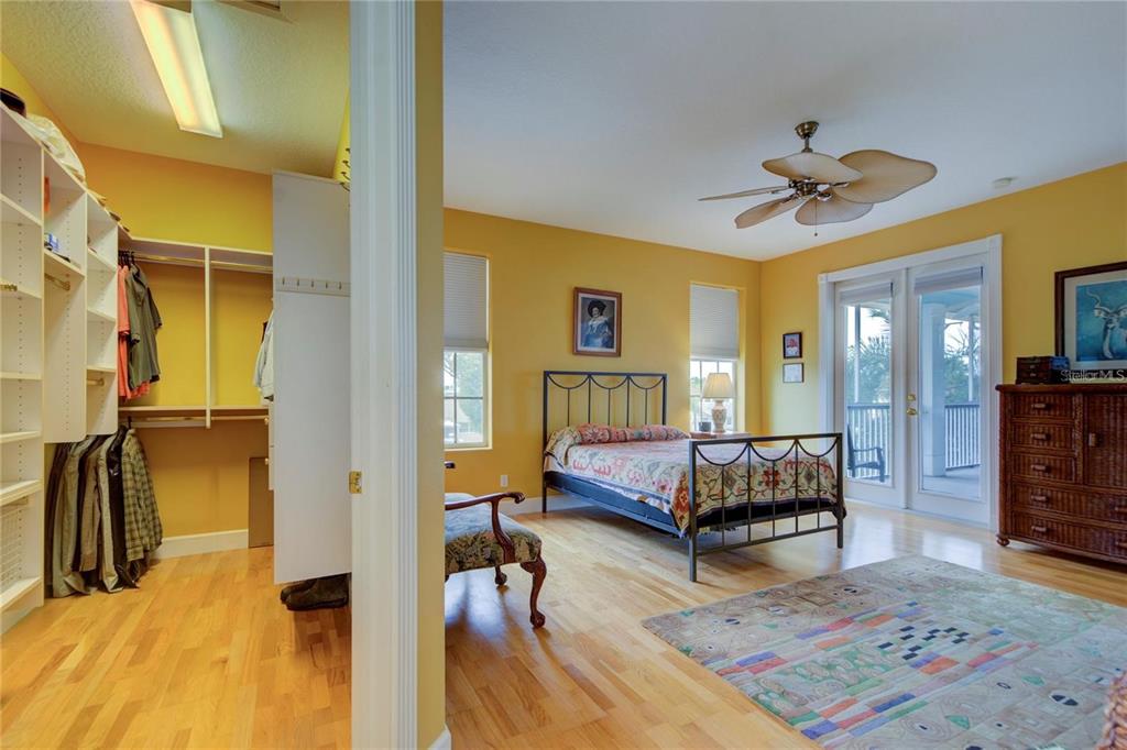 7352 Gulf Way Hudson, FL 34667 - Photo 20 of 69 a bedroom with a bed and wooden floor