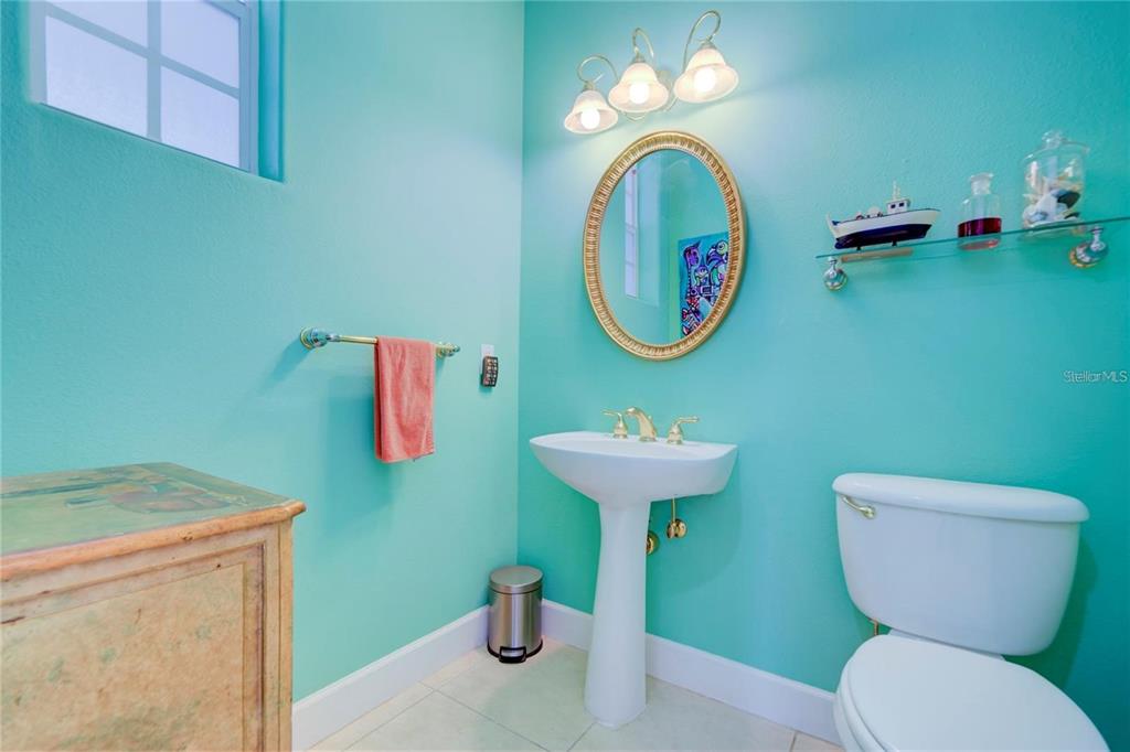 7352 Gulf Way Hudson, FL 34667 - Photo 26 of 69 a bathroom with a toilet sink and mirror