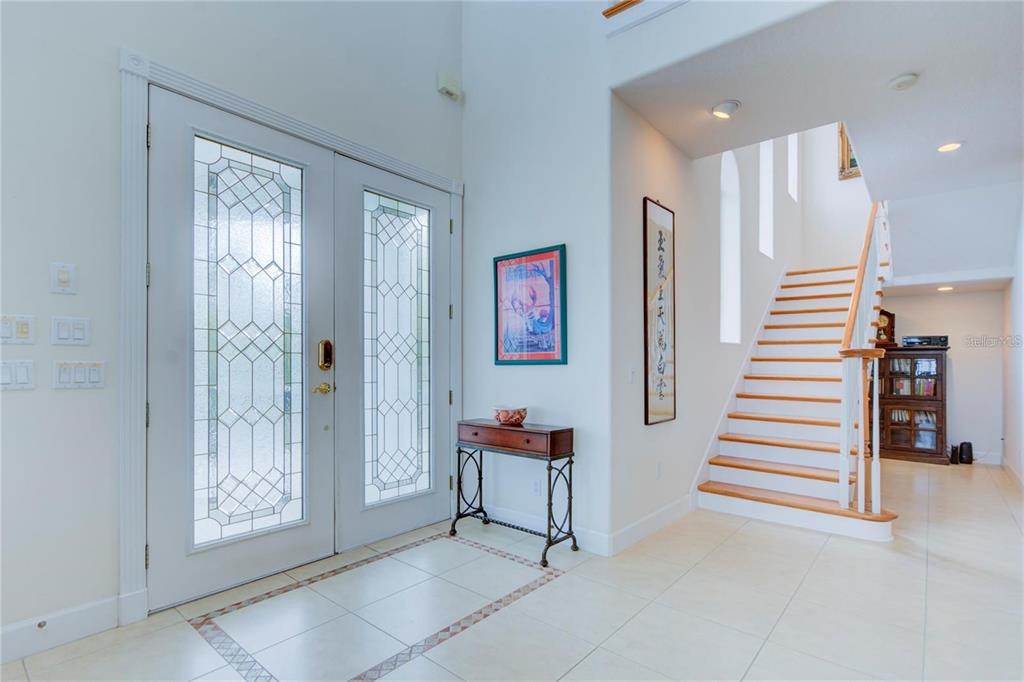 7352 Gulf Way Hudson, FL 34667 - Photo 4 of 69 a view of a hallway with stairs and furniture