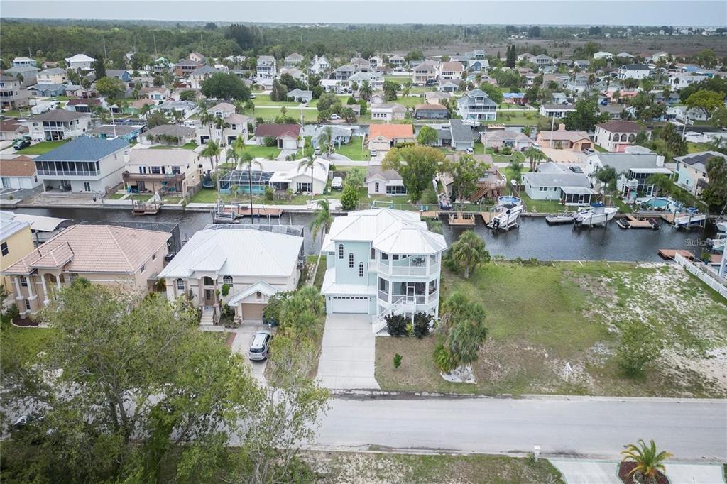 7352 Gulf Way Hudson, FL 34667 - Photo 67 of 69 an aerial view of residential houses with outdoor space and parking