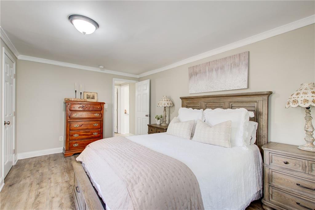 411 Ash Street Monroe, GA 30655 - Photo 23 of 36 a bedroom with a bed and furniture