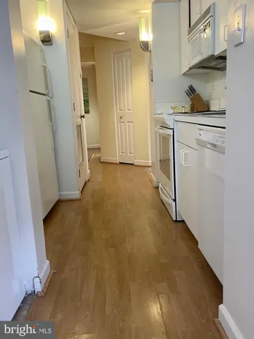 a view of a kitchen from the hallway