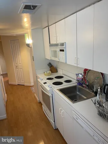 a kitchen with a stove and a sink