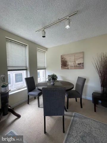 a view of a livingroom with furniture and a window