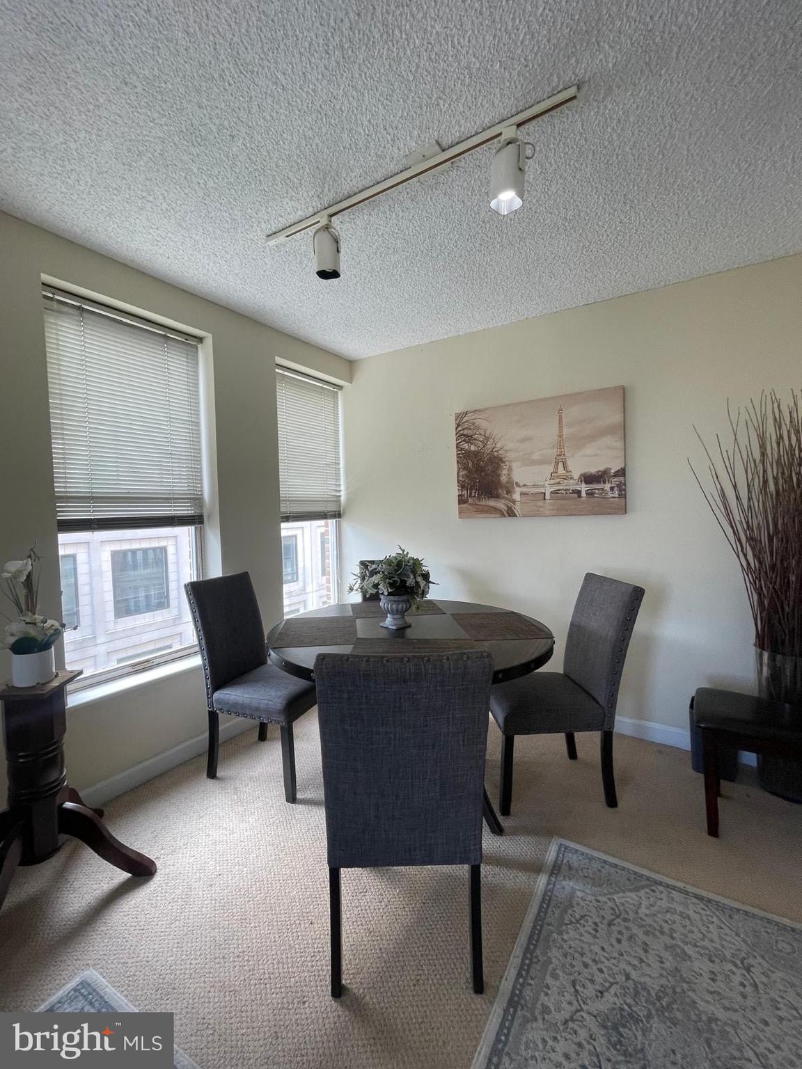 601 Pennsylvania Avenue Northwest, Unit 710 Washington, DC 20004 - Photo 4 of 20 a view of a livingroom with furniture and a window