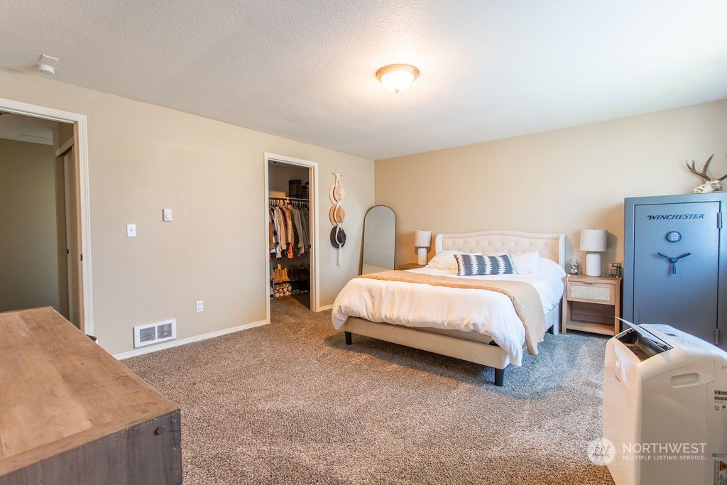 250 Classe Road Toledo, WA 98591 - Photo 11 of 25 a bedroom with a bed and a potted plant