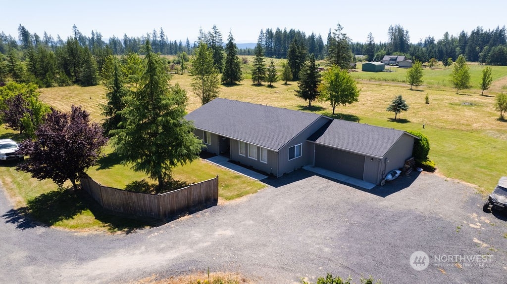 250 Classe Road Toledo, WA 98591 - Photo 2 of 25 a swimming pool with outdoor seating and a garden