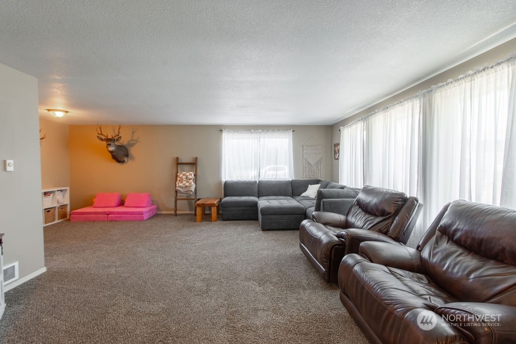 250 Classe Road Toledo, WA 98591 - Photo 4 of 25 a living room with furniture and a large window