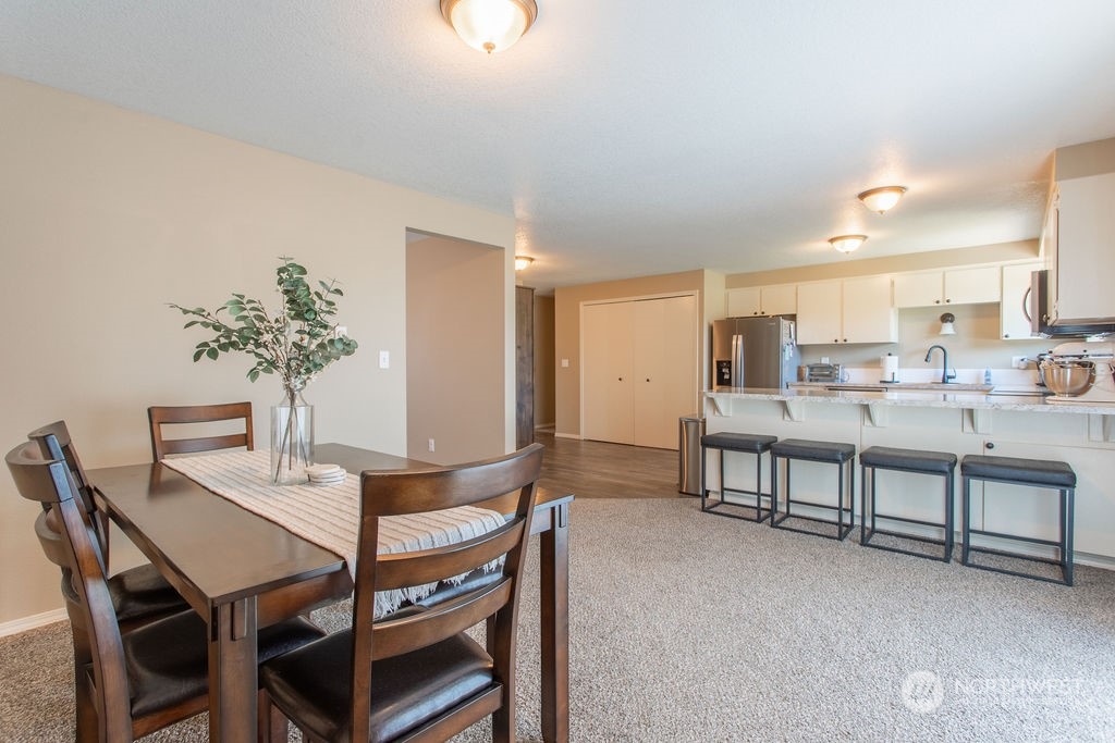 250 Classe Road Toledo, WA 98591 - Photo 8 of 25 a view of a dining room with furniture and a potted plant