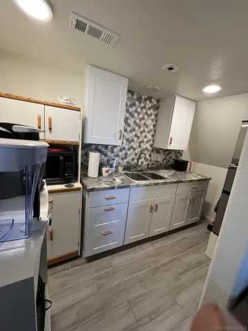 a living room with furniture and a rug