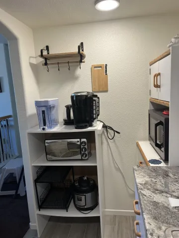 a view of room with racks on the wall