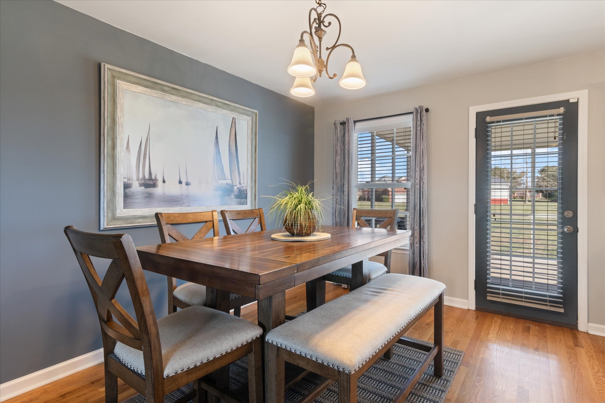 1004 Weiss Road Cottontown, TN 37048 - Photo 5 of 26 a view of a dining room with furniture and wooden floor