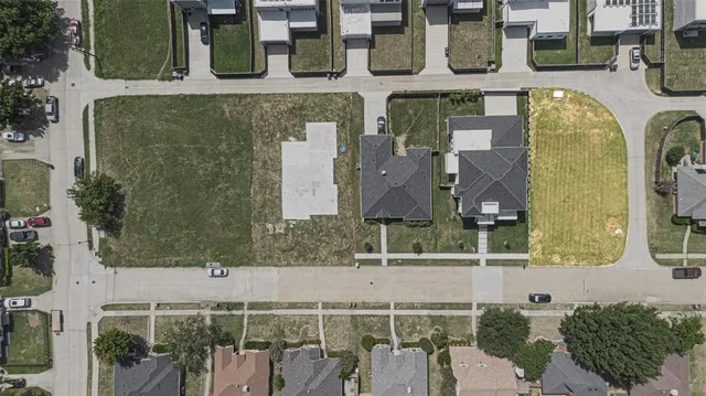 an aerial view of a house with swimming pool