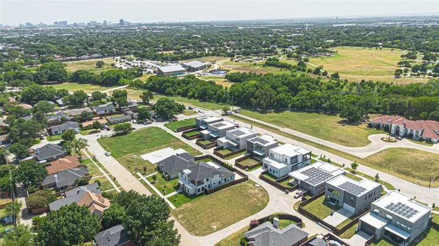 an aerial view of residential houses with outdoor space
