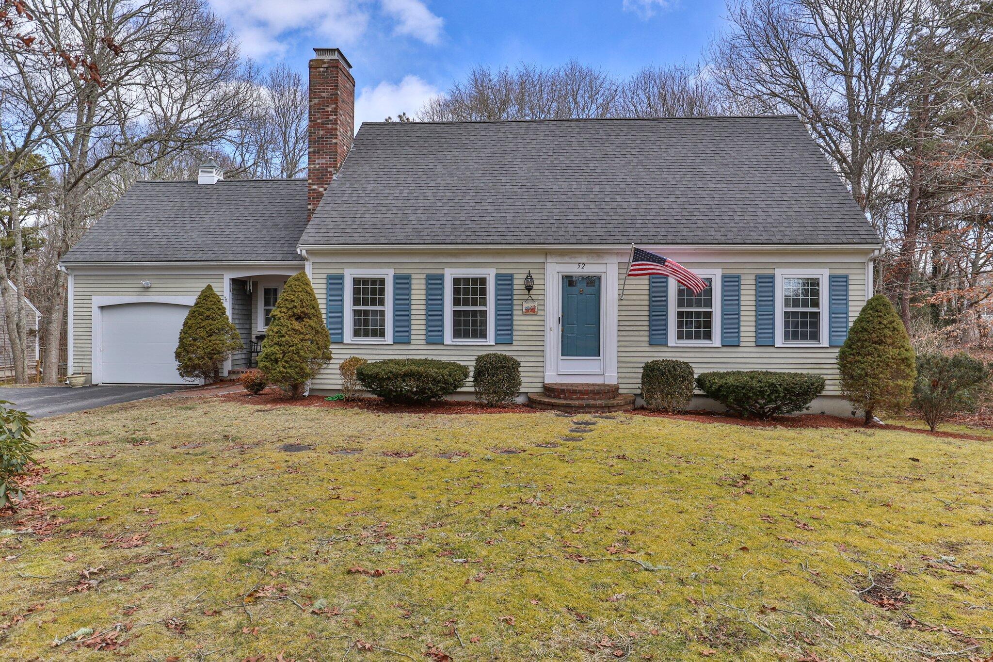 52 Goose Point Road Centerville, MA 02601 - Photo 1 of 71 a backyard of a house with potted plants and large tree