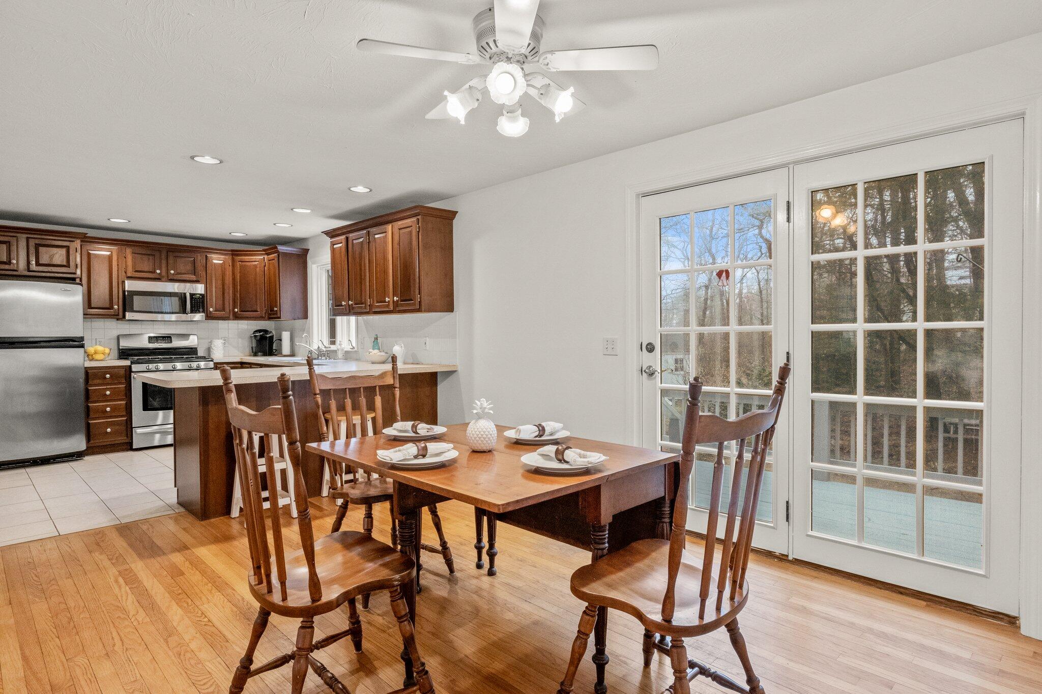 52 Goose Point Road Centerville, MA 02601 - Photo 16 of 71 a view of a dining room with furniture and wooden floor