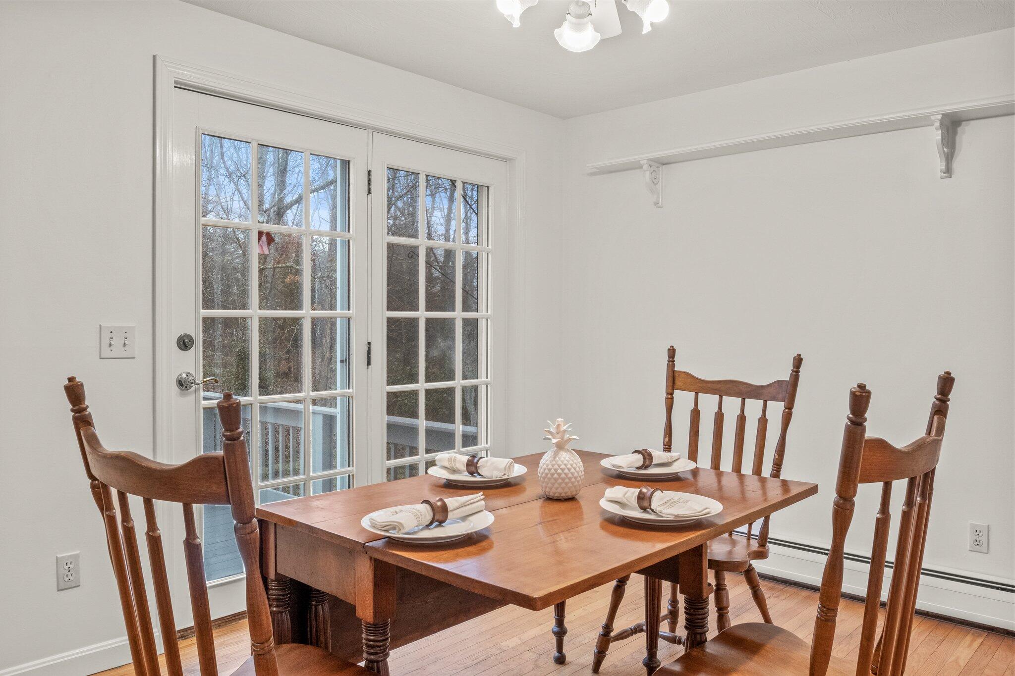52 Goose Point Road Centerville, MA 02601 - Photo 17 of 71 a view of a dining room with furniture and window