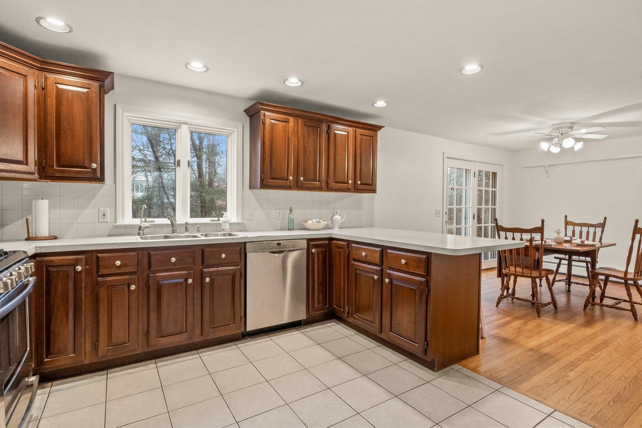 52 Goose Point Road Centerville, MA 02601 - Photo 23 of 71 a kitchen with stainless steel appliances granite countertop a sink and cabinets