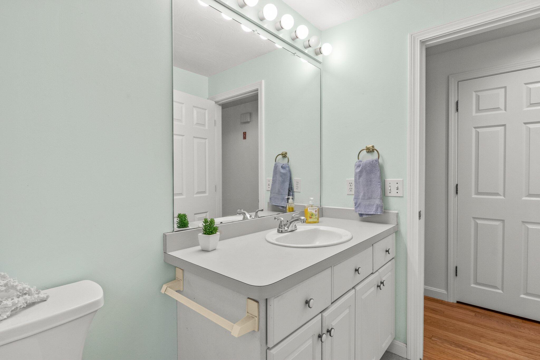 52 Goose Point Road Centerville, MA 02601 - Photo 24 of 71 a bathroom with a sink vanity and a toilet