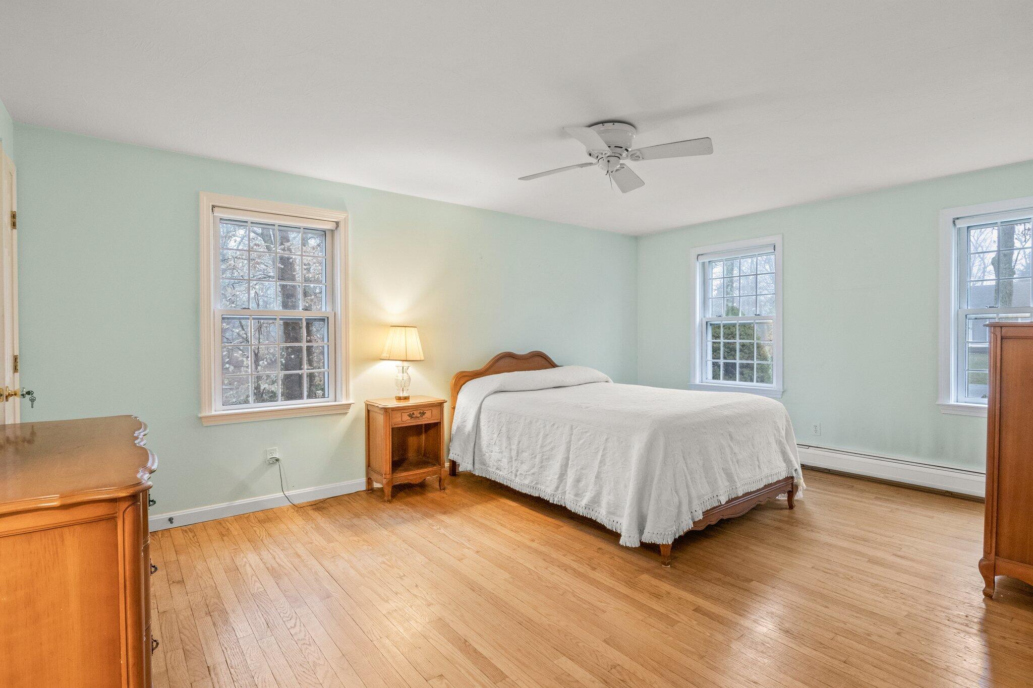 52 Goose Point Road Centerville, MA 02601 - Photo 26 of 71 a spacious bedroom with a bed and wooden floor