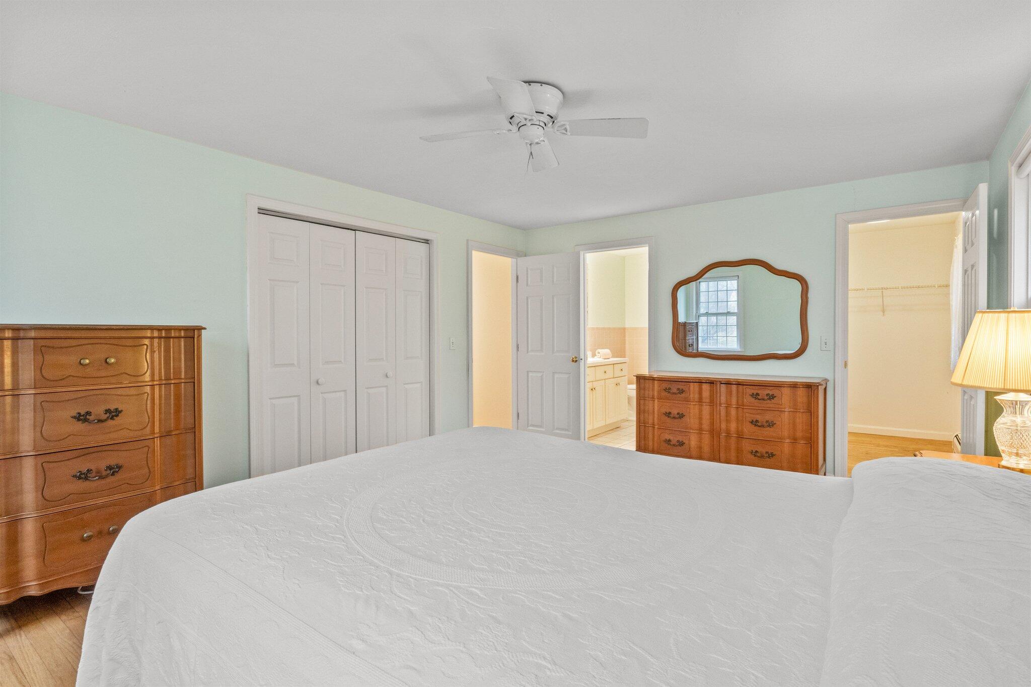 52 Goose Point Road Centerville, MA 02601 - Photo 27 of 71 a bedroom with a bed a dresser and mirror