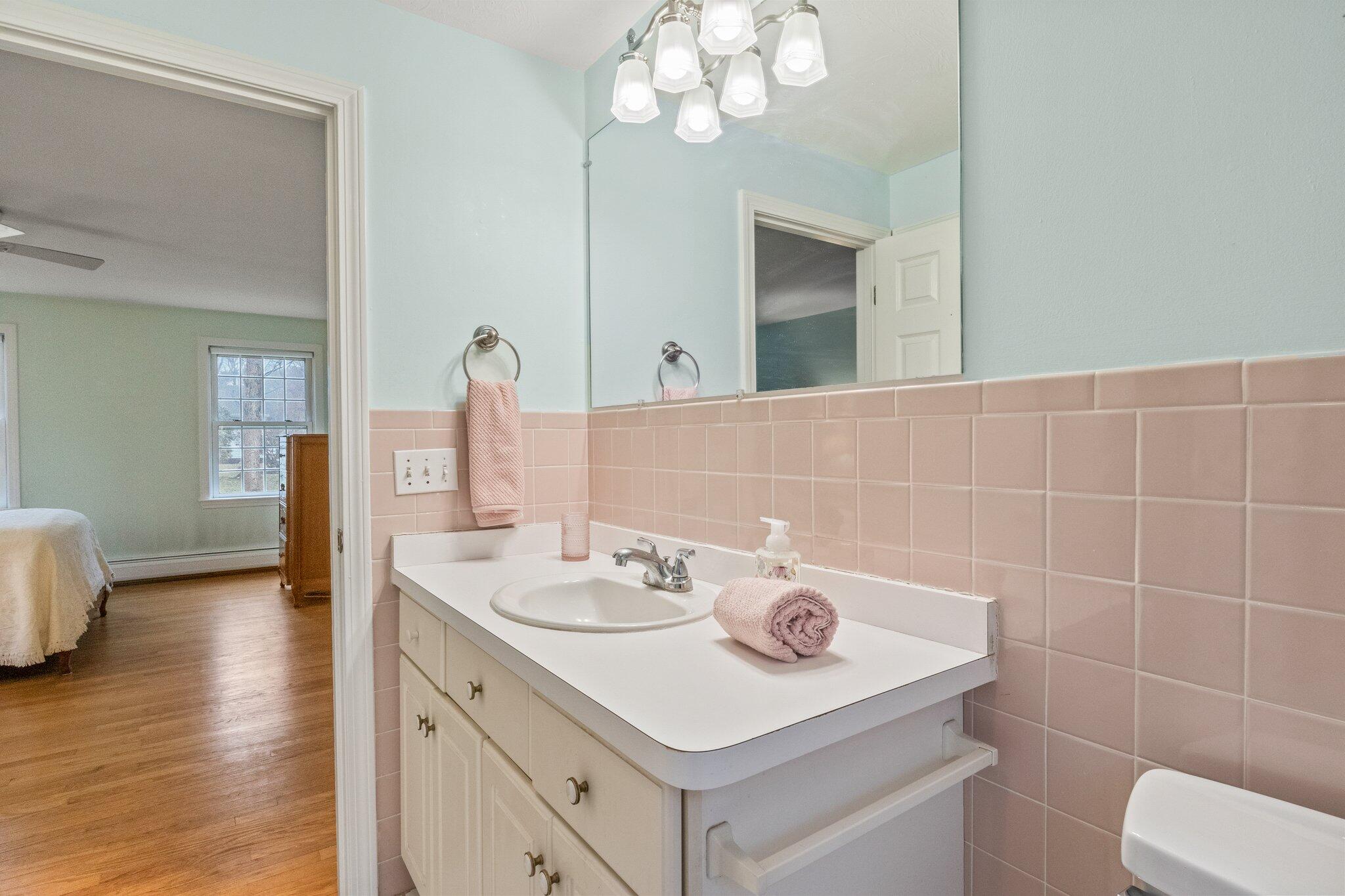 52 Goose Point Road Centerville, MA 02601 - Photo 31 of 71 a bathroom with a sink vanity and a mirror