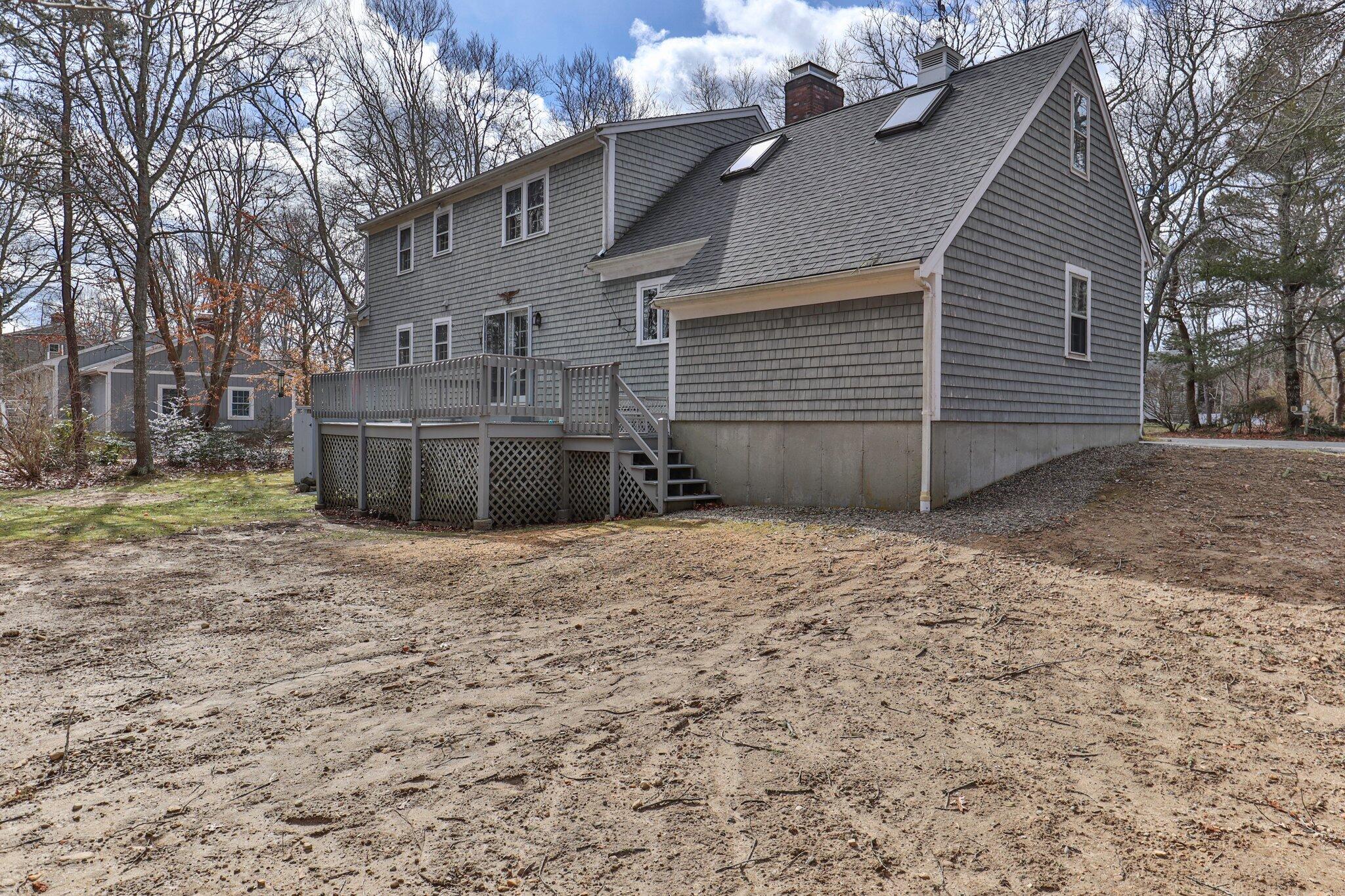 52 Goose Point Road Centerville, MA 02601 - Photo 56 of 71 a view of a house with a yard