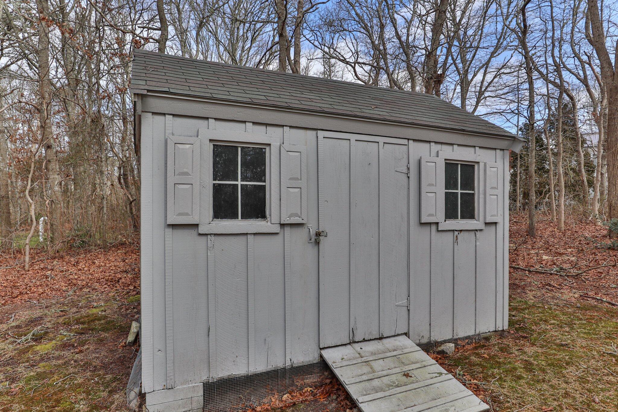 52 Goose Point Road Centerville, MA 02601 - Photo 58 of 71 a view of wooden door and a bench