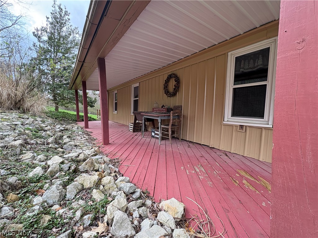 64446 Erie Road Salesville, OH 43778 - Photo 5 of 32 Wooden terrace with a bar