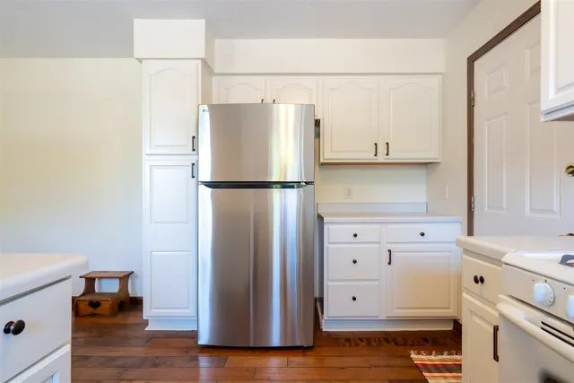 a white refrigerator freezer sitting in a kitchen