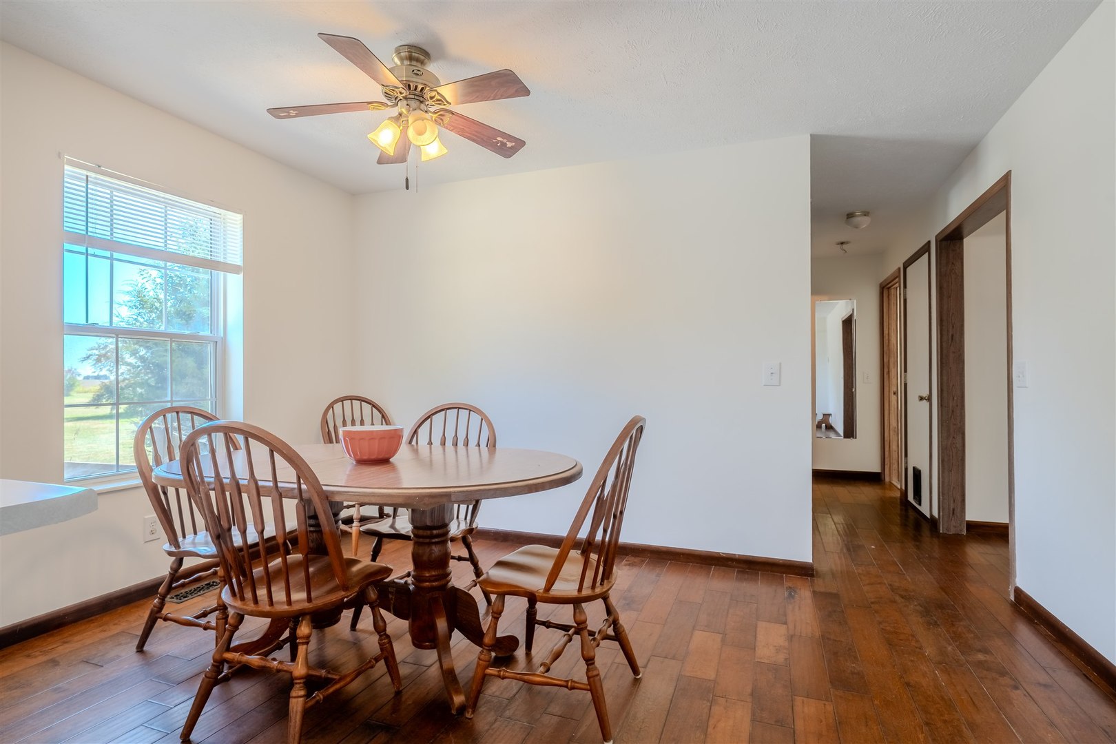 4397 North 3200 East Road Arrowsmith, IL 61722 - Photo 12 of 33 a view of a dining room with furniture window and wooden floor