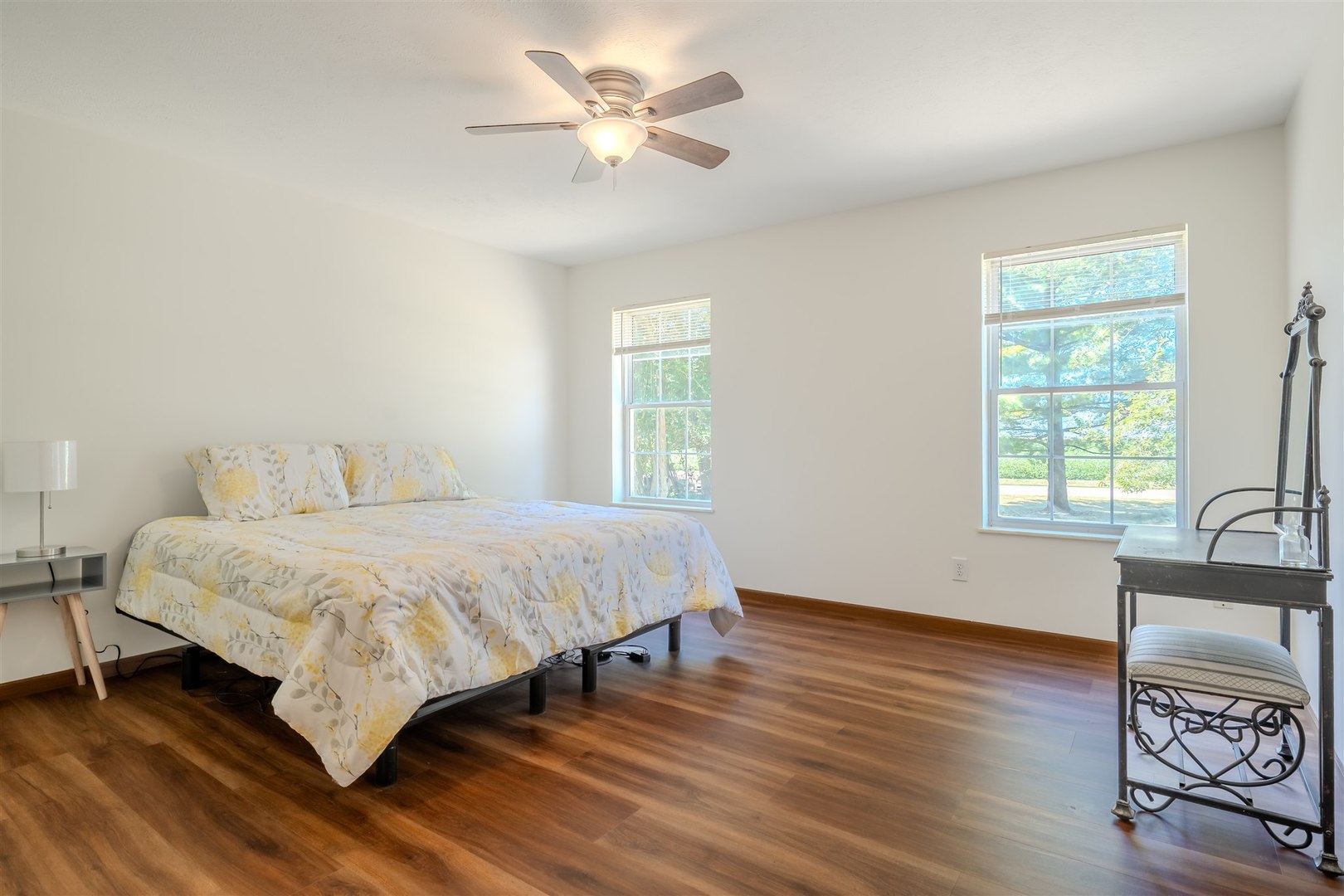 4397 North 3200 East Road Arrowsmith, IL 61722 - Photo 15 of 33 a spacious bedroom with a bed and a chair