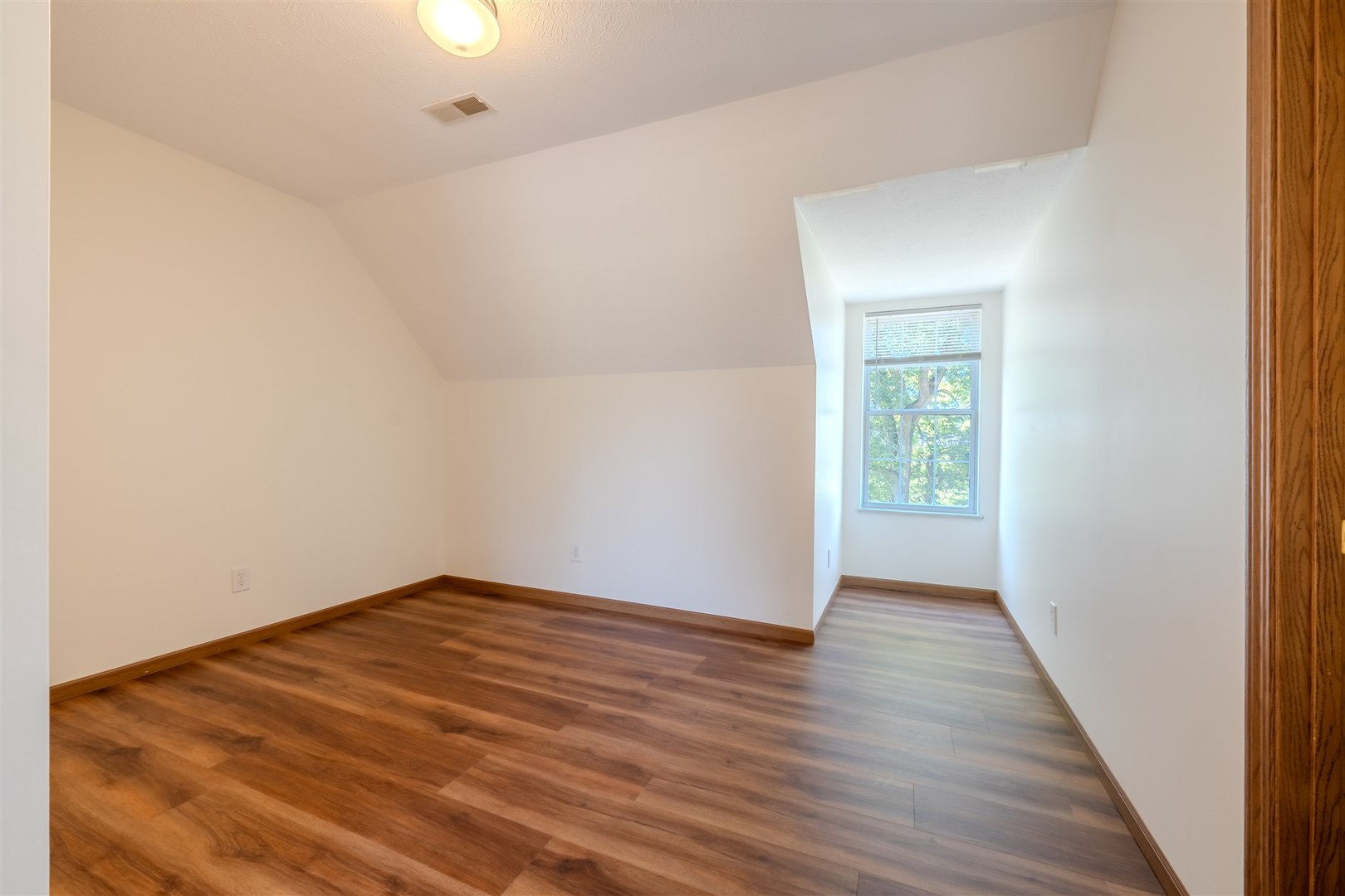 4397 North 3200 East Road Arrowsmith, IL 61722 - Photo 21 of 33 a view of an empty room with wooden floor and a window