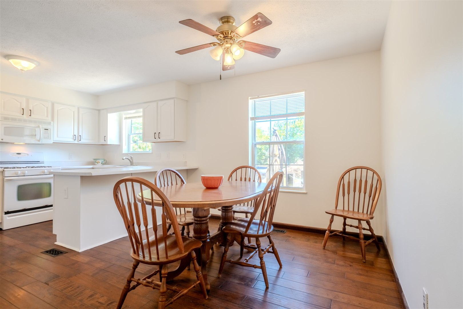 4397 North 3200 East Road Arrowsmith, IL 61722 - Photo 8 of 33 a view of a dining room with furniture and a chandelier fan